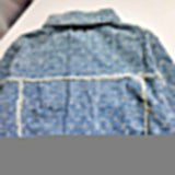 Back view of Louis Vuitton luxury clothing with signature branding