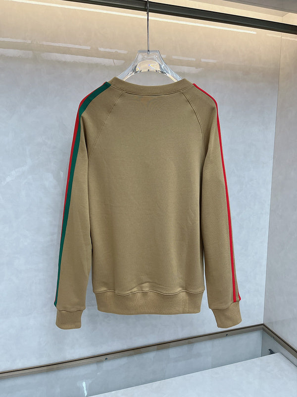 Close-up detail shot of Gucci luxury clothing with monogram-inspired silhouette