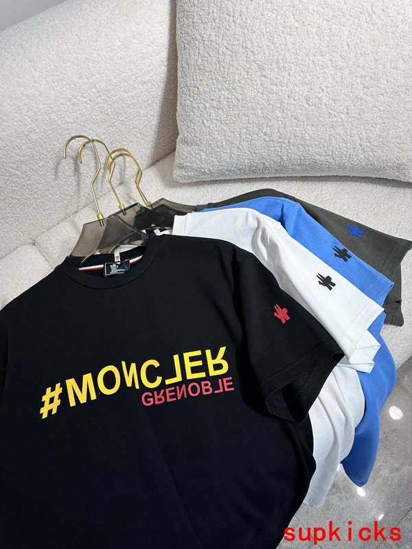 Close-up detail shot of Moncler luxury clothing with signature branding
