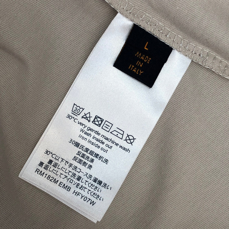 Flat lay presentation of Louis Vuitton cotton t-shirt with logo-detail design