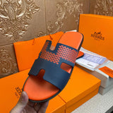 Hermes shoes Style 028 - close-up of statement logo accent
