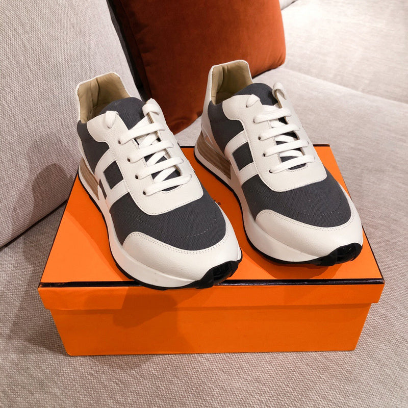 Hermès White High-Top Sneakers - Angled View