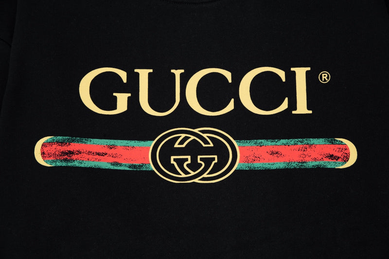 Flat lay presentation of Gucci luxury clothing with relaxed-fit cut