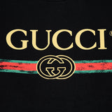 Flat lay presentation of Gucci luxury clothing with relaxed-fit cut