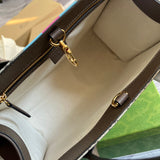 Close-up detail of elevated signature women's handbag – women's statement bag