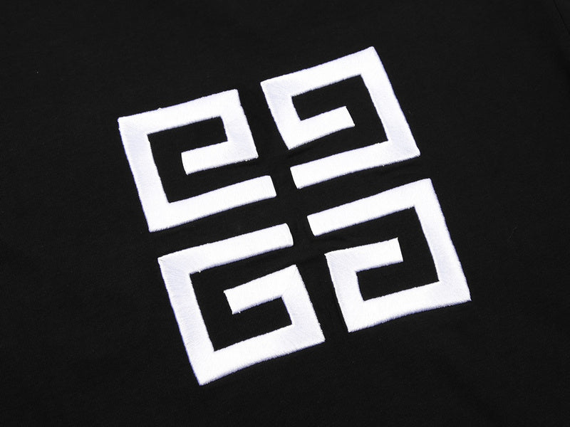 Flat lay presentation of Givenchy luxury clothing with signature branding