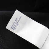 Close-up detail shot of Louis Vuitton luxury clothing with tailored silhouette