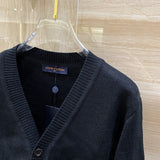 Close-up detail shot of Louis Vuitton luxury clothing with monogram-inspired silhouette