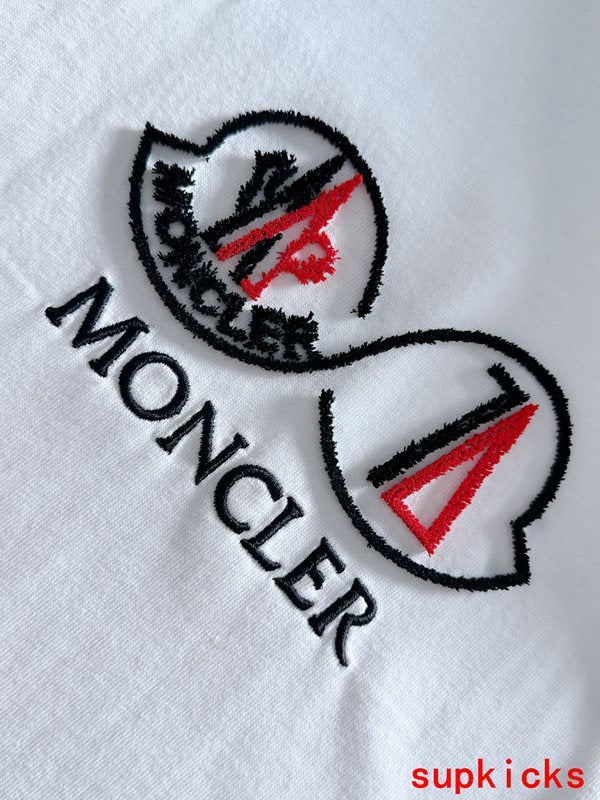 Close-up detail shot of Moncler luxury clothing with tailored silhouette