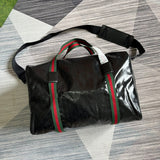 Close-up detail of structured polished women's handbag – women's statement bag