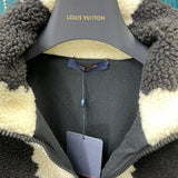 Close-up detail shot of Louis Vuitton luxury clothing with signature branding