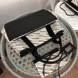 Top view of chic classic women's handbag – women's designer-style accessory