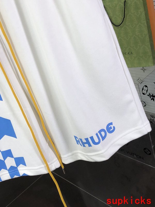 Flat lay presentation of Rhude luxury clothing with logo-detail design
