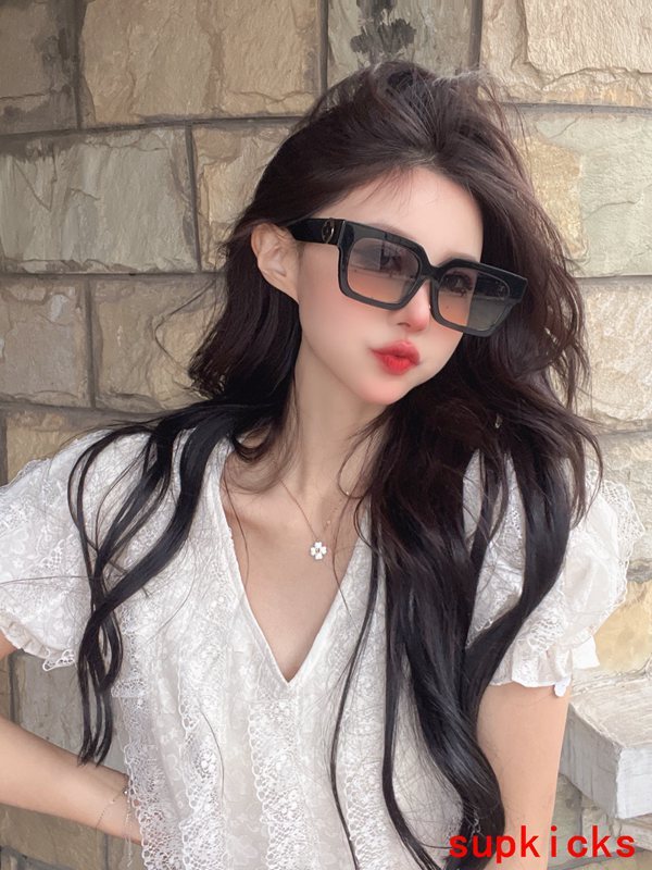 Close-up detail view of Louis Vuitton unisex sunglasses