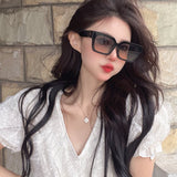 Close-up detail view of Louis Vuitton unisex sunglasses