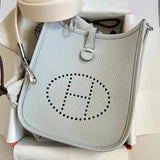  structured top-handle bag styled with outfit 30