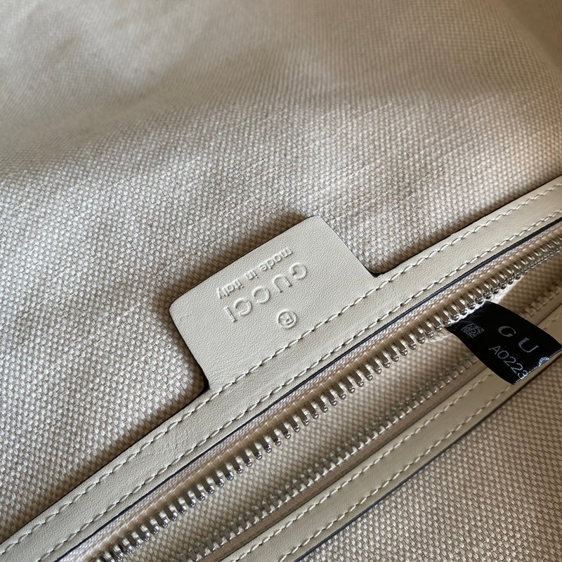 Side profile of polished everyday-luxe women's handbag – women's statement bag