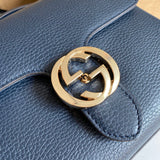 Handle and strap detail of modern sleek women's handbag – women's designer-style accessory
