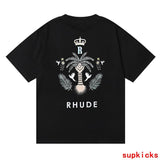 Flat lay presentation of Rhude luxury clothing with label-forward styling