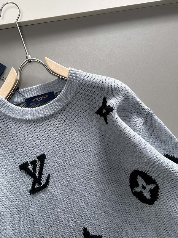 Close-up detail shot of Louis Vuitton luxury clothing with signature branding