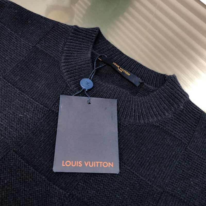 Close-up detail shot of Louis Vuitton luxury clothing with monogram-inspired silhouette