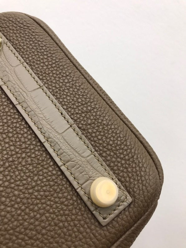 Side view of modern structured handbag