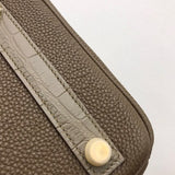Side view of modern structured handbag