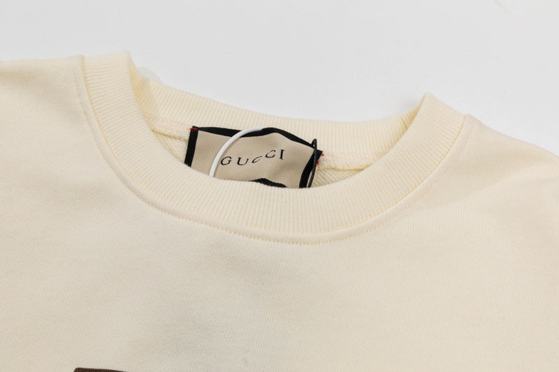 Close-up detail shot of Gucci luxury clothing with relaxed-fit cut