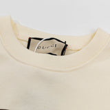 Close-up detail shot of Gucci luxury clothing with relaxed-fit cut