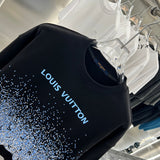 Close-up detail shot of Louis Vuitton luxury clothing with tailored silhouette