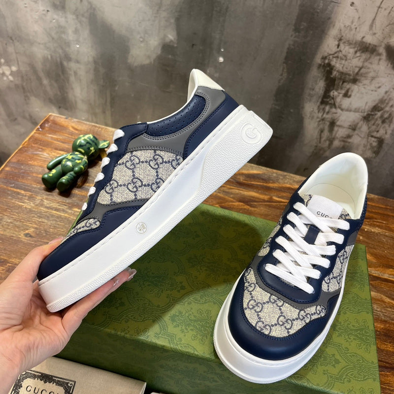 Side profile of Gucci fresh white-and-black sneakers sleek tonal finish