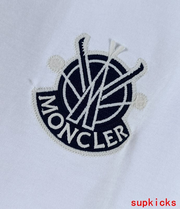 Full styled look of Moncler luxury clothing with signature branding