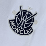 Full styled look of Moncler luxury clothing with signature branding