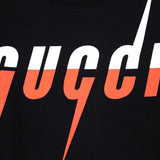 Flat lay presentation of Gucci luxury clothing with tailored silhouette