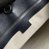 Side profile of refined chic women's handbag – women's statement bag