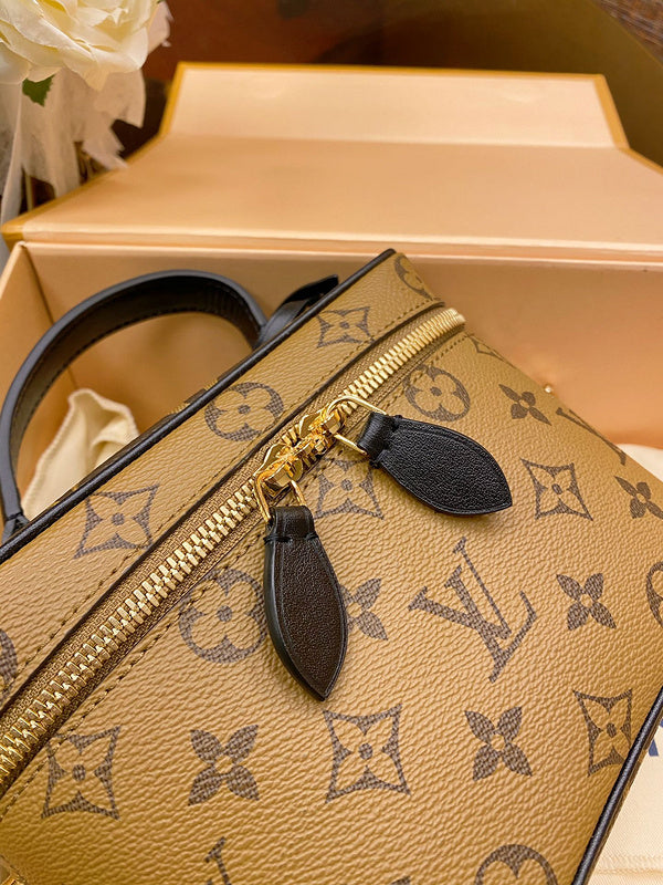 Handle and strap detail of elevated everyday-luxe women's handbag – women's statement bag