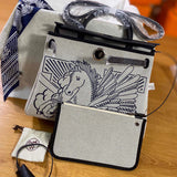 Side view of understated structured handbag