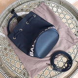 Styled lifestyle shot of statement sleek women's handbag – women's statement bag