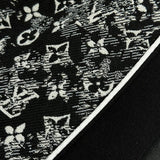 Front view of Louis Vuitton luxury clothing with label-forward styling