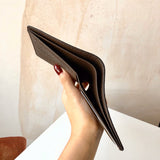 Handle and strap detail of sleek modern women's handbag – women's luxury accessory