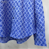 Front view of Louis Vuitton luxury clothing with signature branding