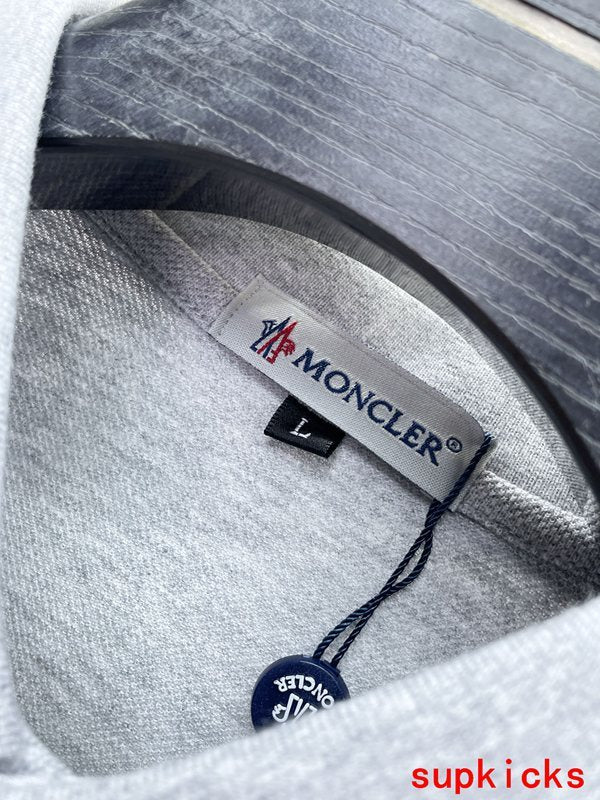 Side profile of Moncler luxury clothing with logo-detail design
