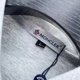 Side profile of Moncler luxury clothing with logo-detail design