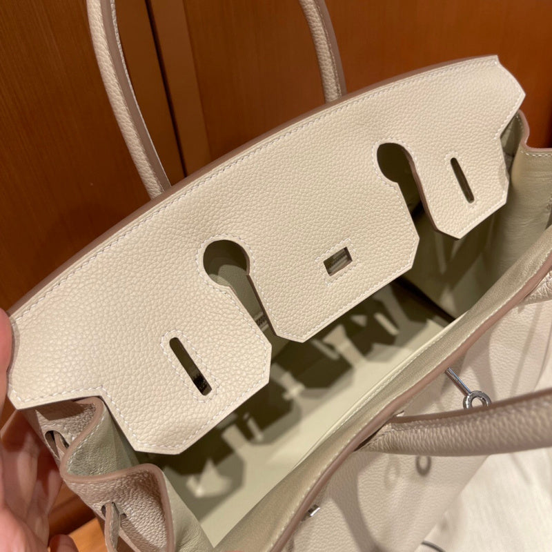Side view of curated structured handbag