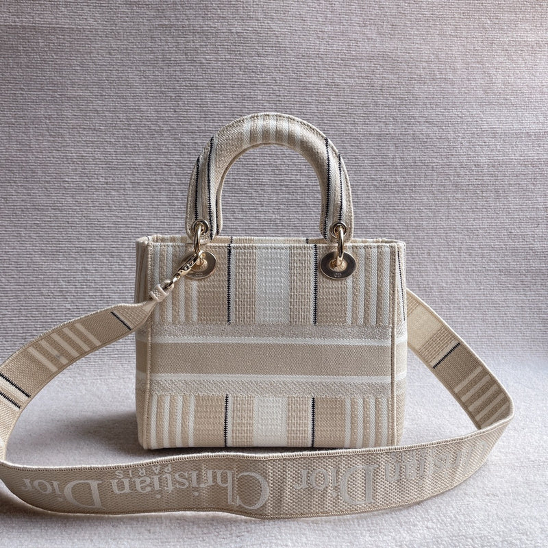 Close-up detail of polished classic women's handbag – women's luxury accessory