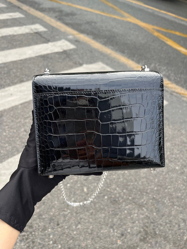 Side view of understated structured handbag