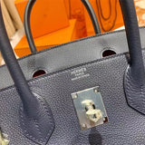 Side view of sleek structured handbag