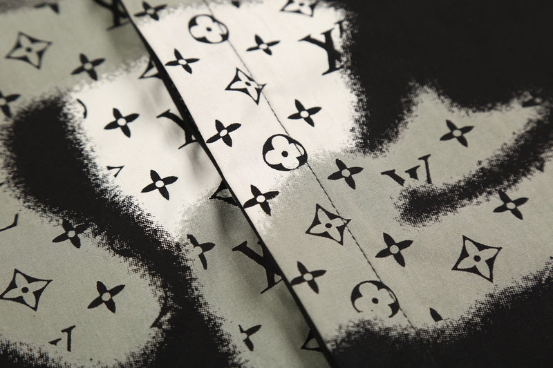 Flat lay presentation of Louis Vuitton luxury clothing with logo-detail design