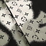 Flat lay presentation of Louis Vuitton luxury clothing with logo-detail design