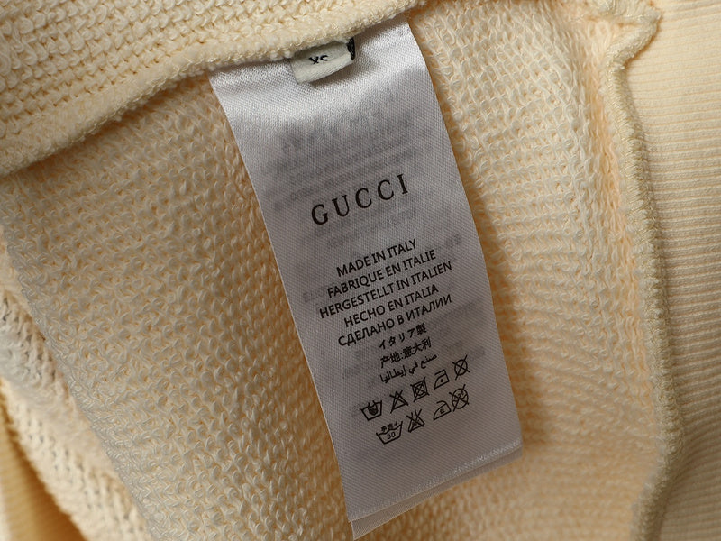 Close-up detail shot of Gucci luxury clothing with tailored silhouette